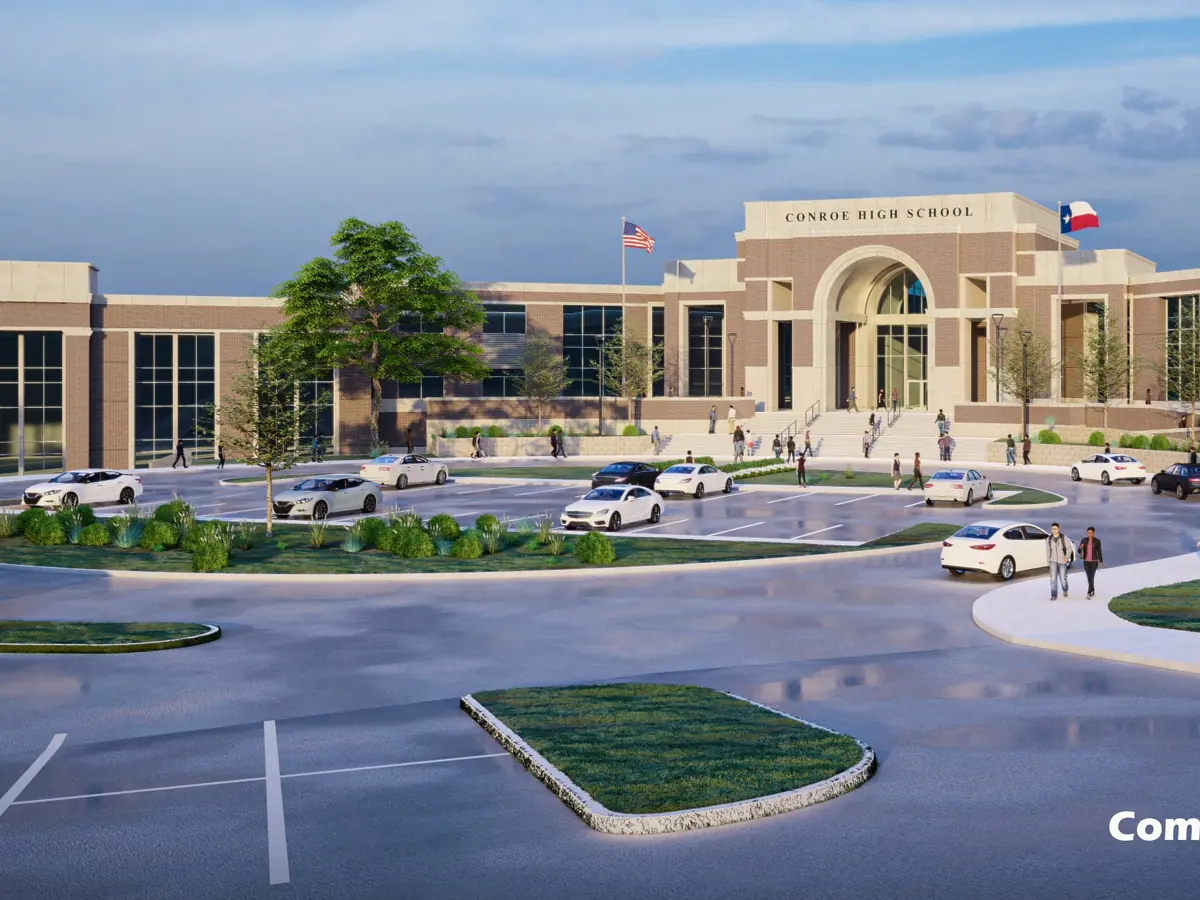 Rendering of the new Conroe High School front entrance, showing a broad beige school building with a central arched entry, a circular driveway, parking spaces, landscaping, and flags.