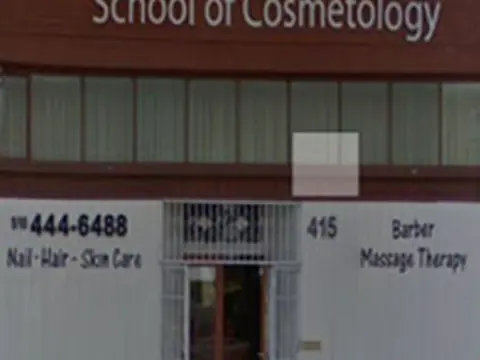 Street-front storefront labeled “Katie Skills Center” and “School of Cosmetology,” with the number 415 visible beside the entrance.
