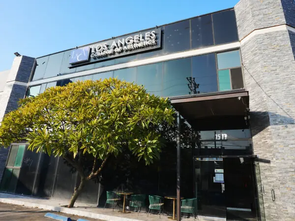 Exterior of the Los Angeles College of Aesthetics building at 1517, with the school name on the upper facade, a tree in front, and the entrance at right.